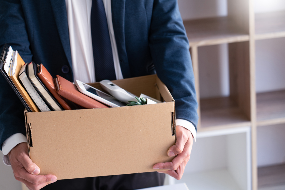 businessmen hold boxes for personal belongings unemployment, stagflation, resigned concept