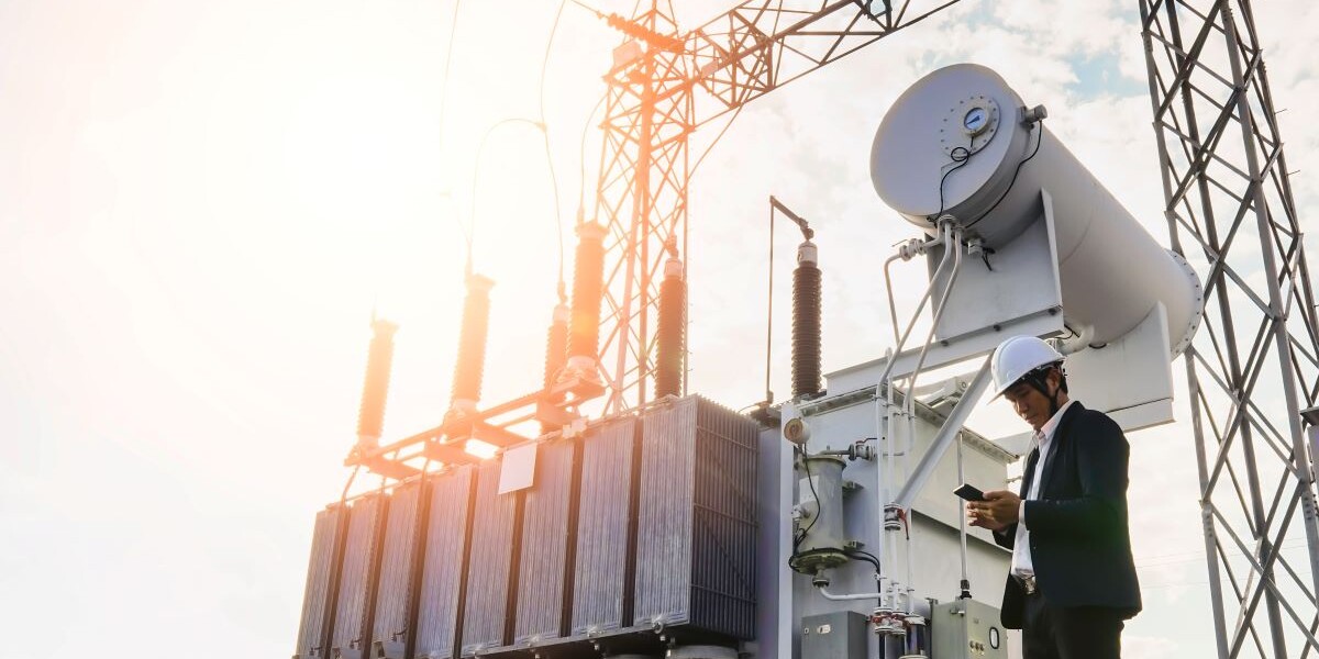 man under oil rig, investor looking at phone, energy transition