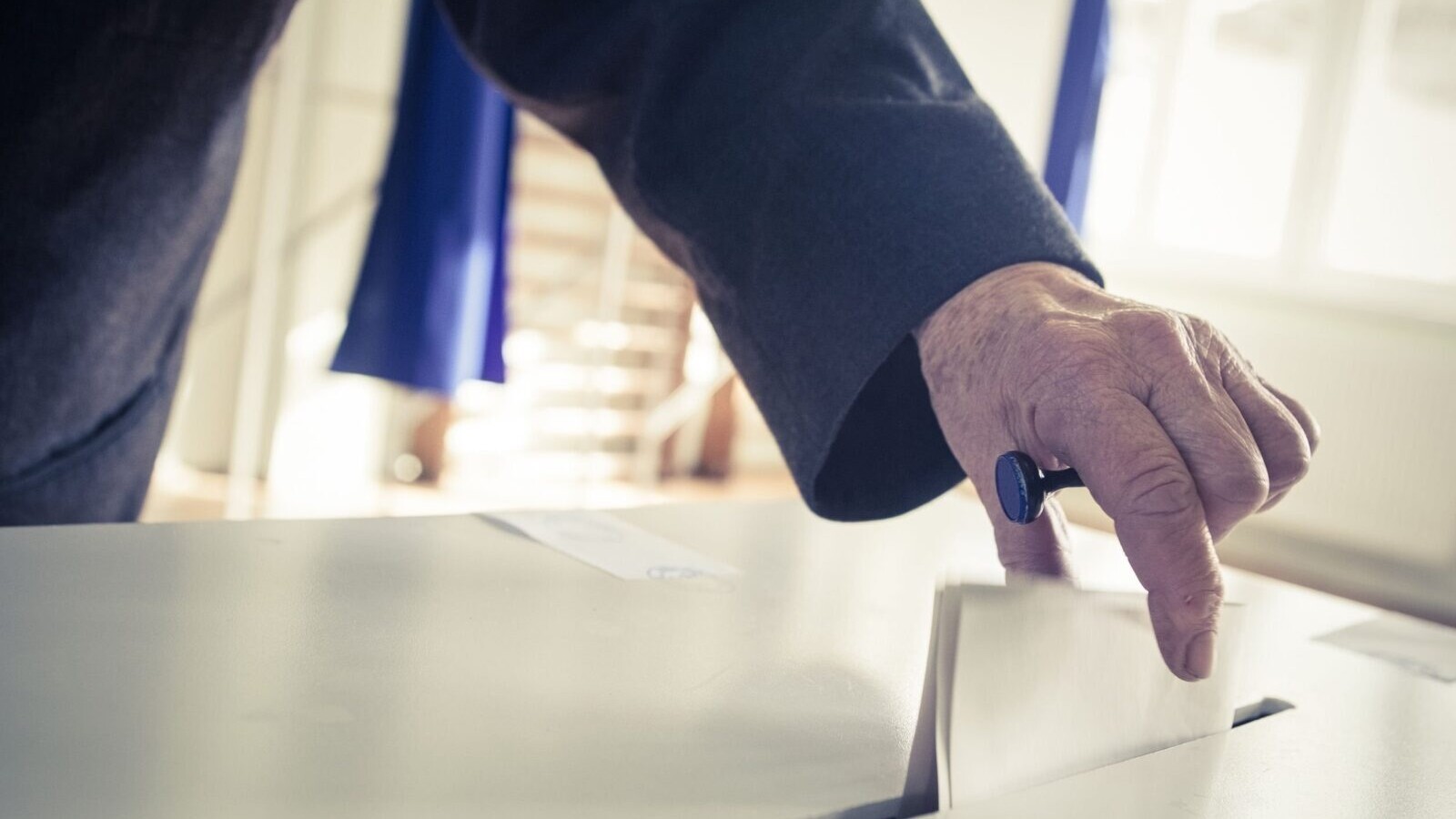 Man casting a ballot.