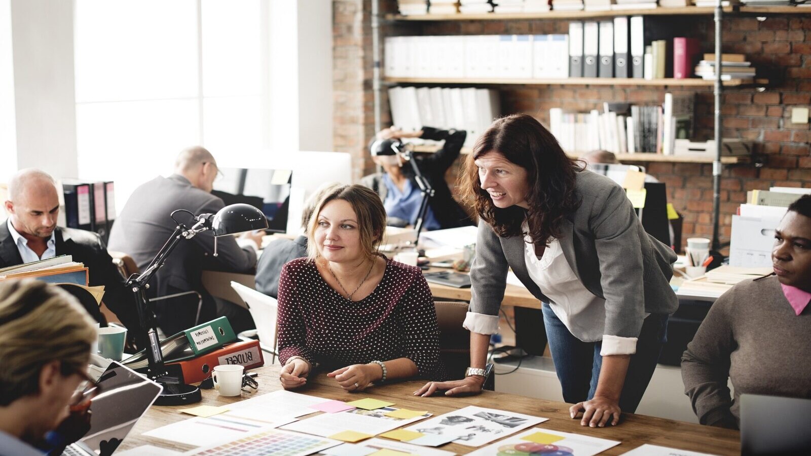 Team brainstorming around a conference table.