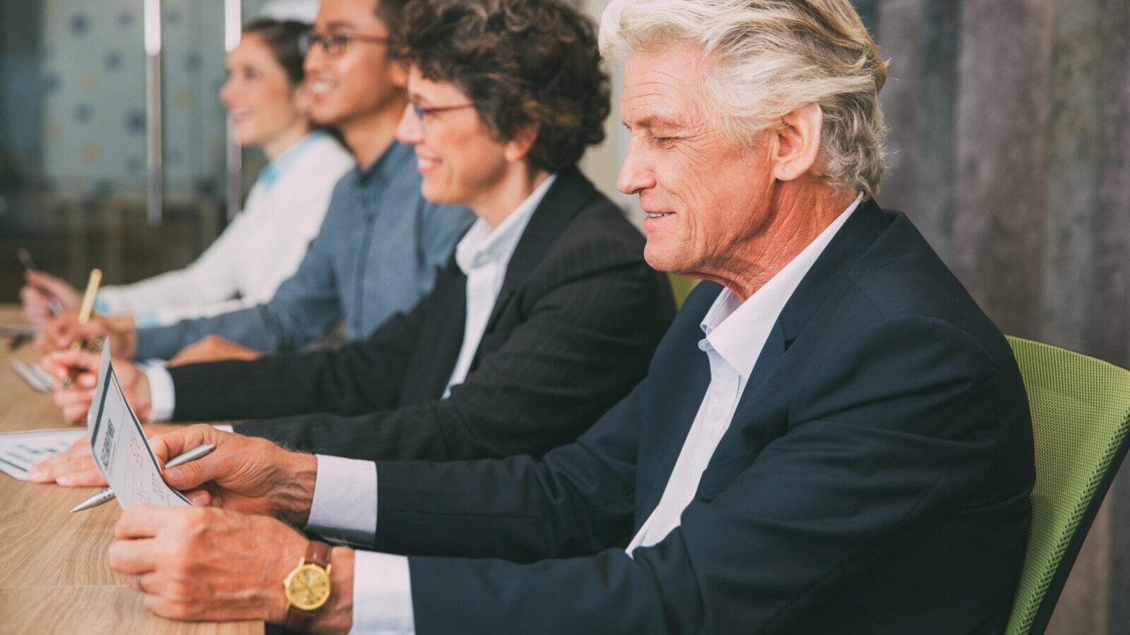 Business people at a conference table.