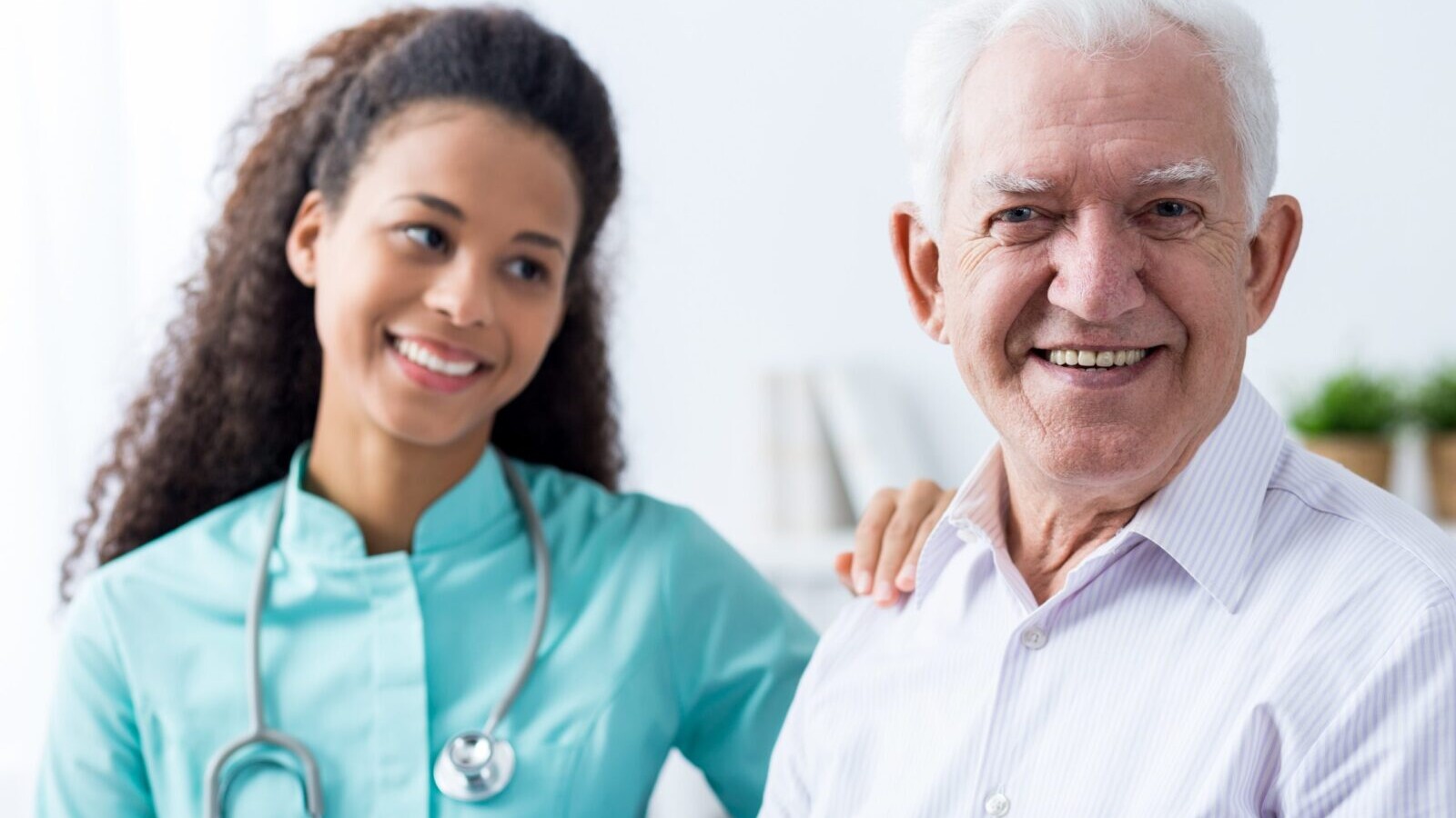 Healthcare nurse with an older man.