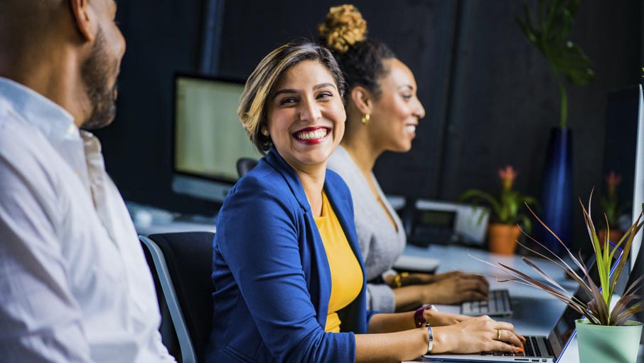 Co-workers, happy at work.