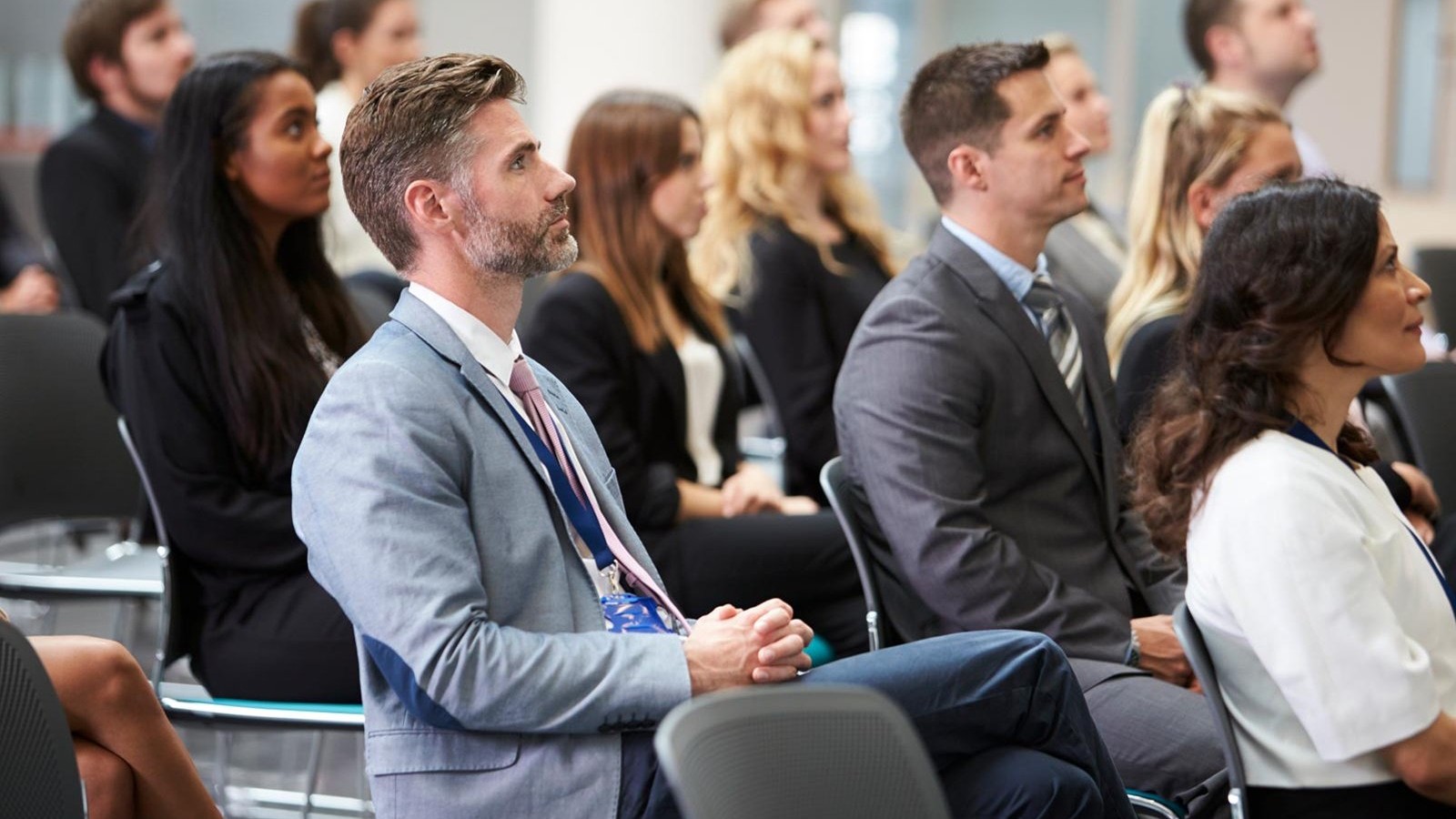Seated attendees at a business conference.
