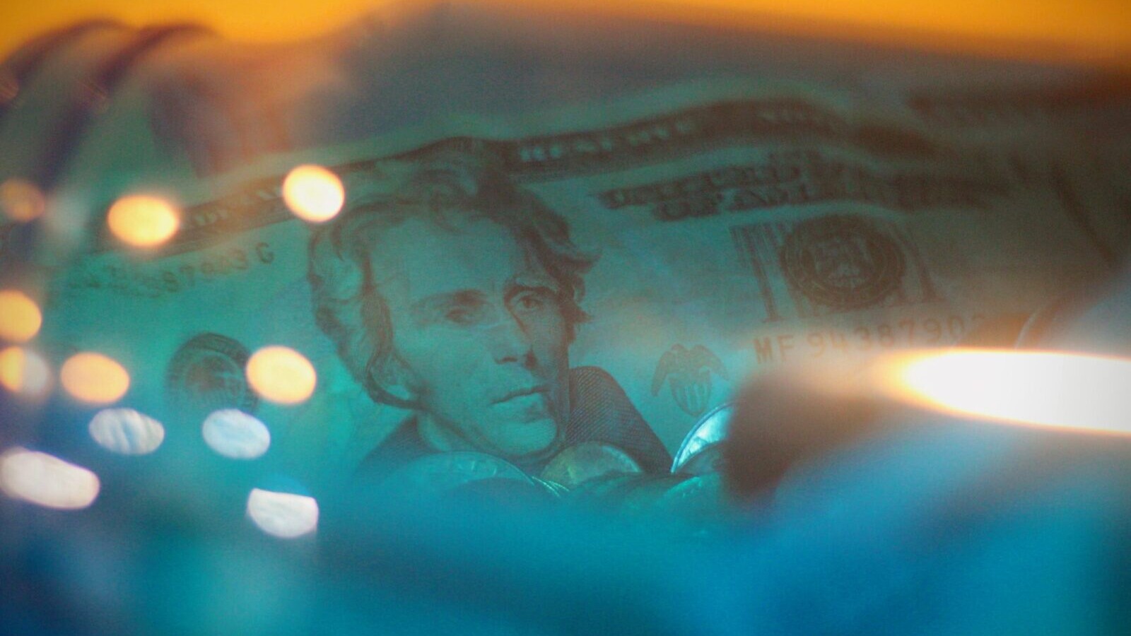 cash inside blue glass jar