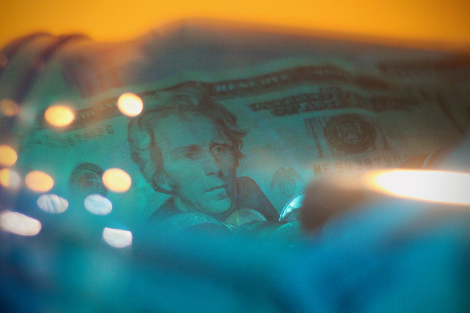cash inside blue glass jar