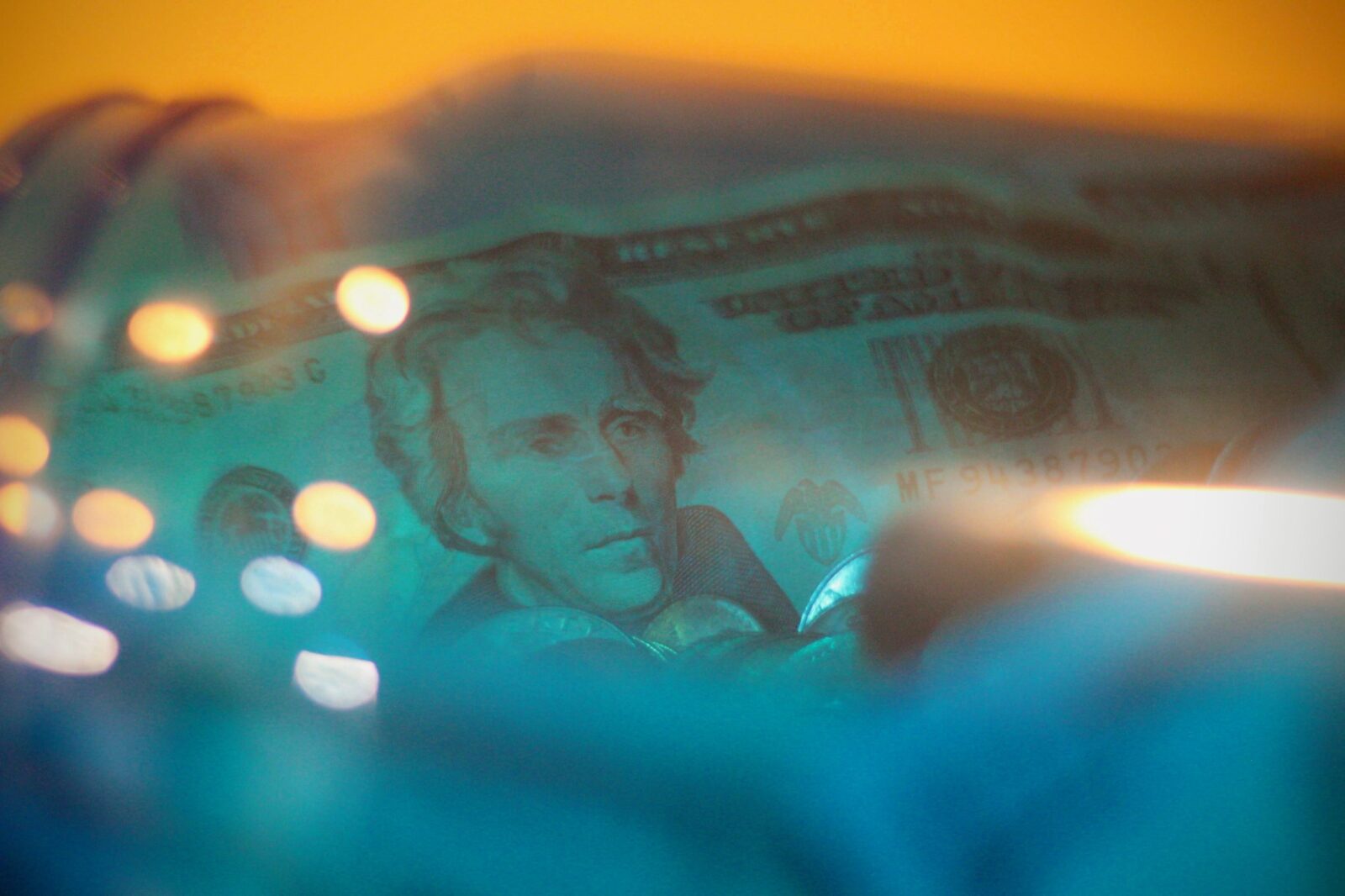 cash inside blue glass jar