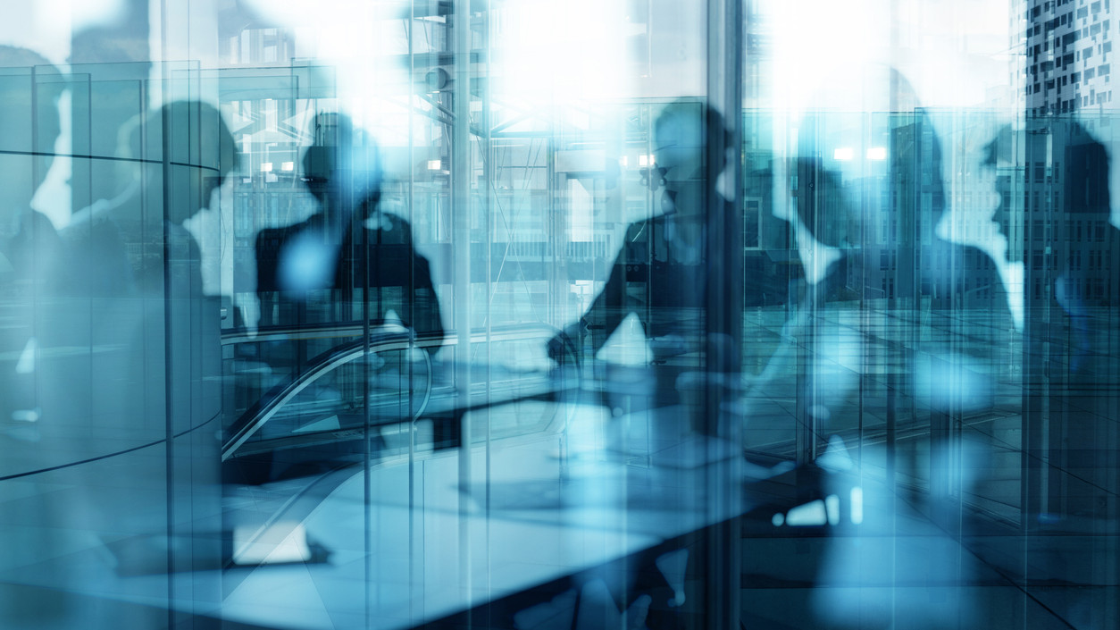 Double exposure of business people who work together in office