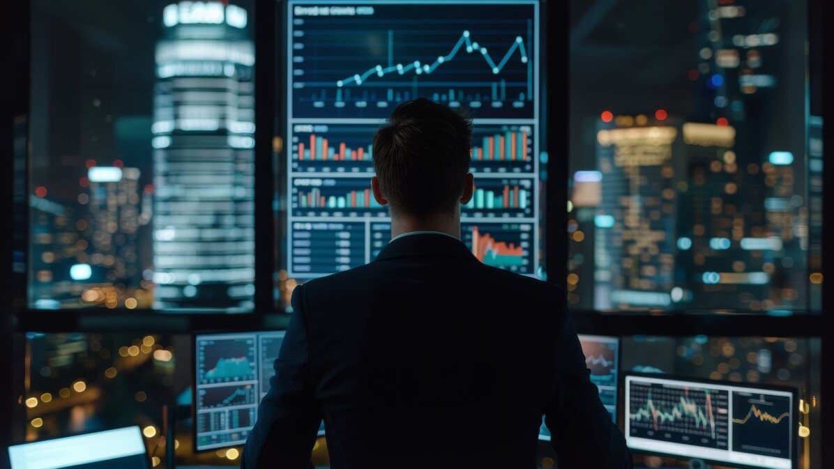 man viewing digital trading data