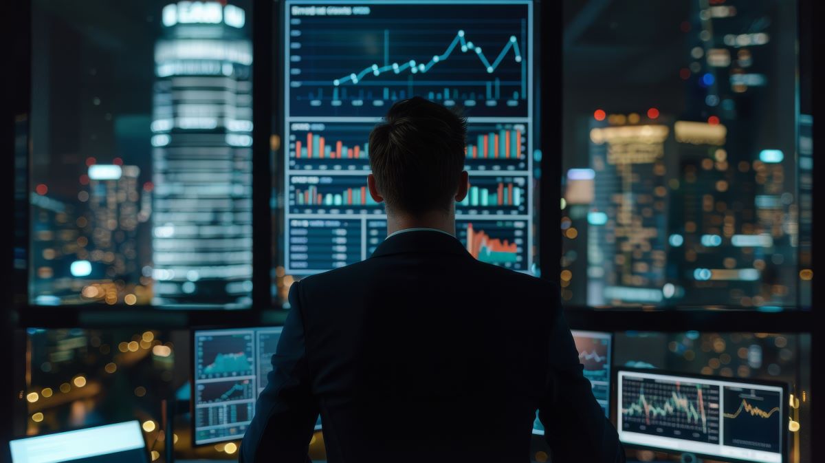 man viewing digital trading data