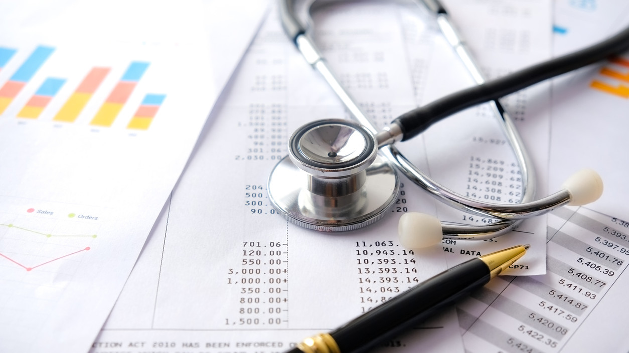 Stethoscope with Pen, Charts and Graphs, Finance, Account, Statistics, Investment, Analytic Research Data Economy Spreadsheet and Business Company Concept