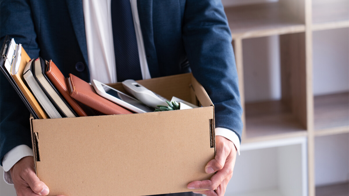 businessmen hold boxes for personal belongings unemployment, stagflation, resigned concept