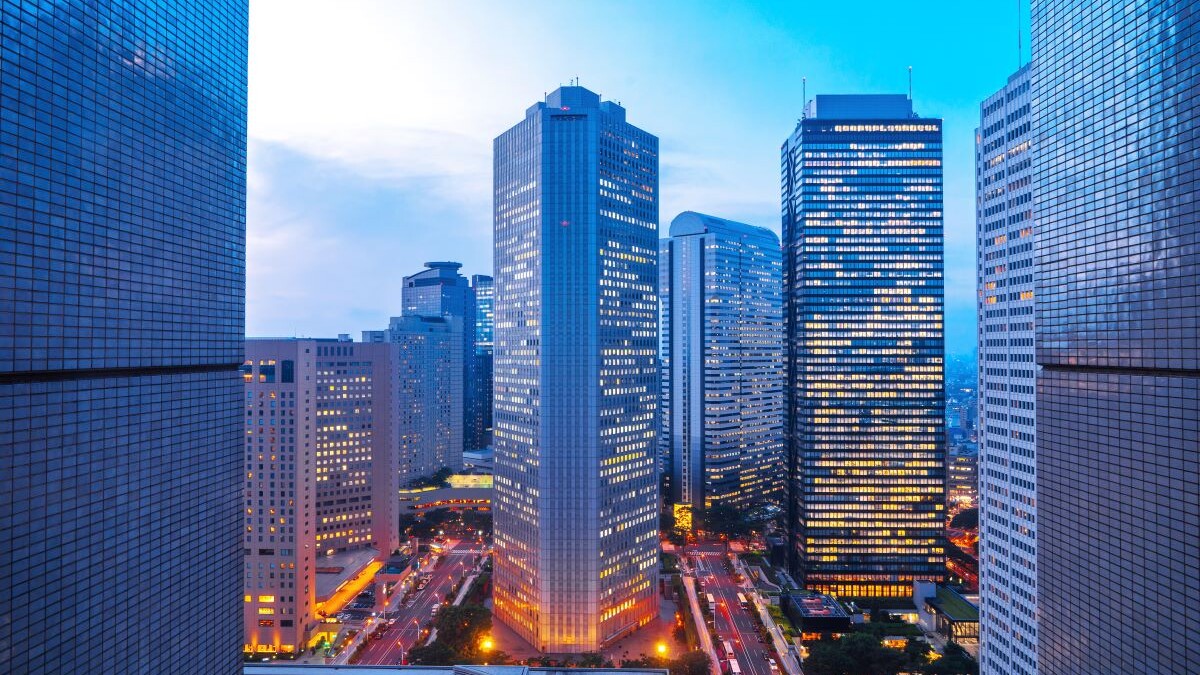 City skyscrapers lit up at twilight