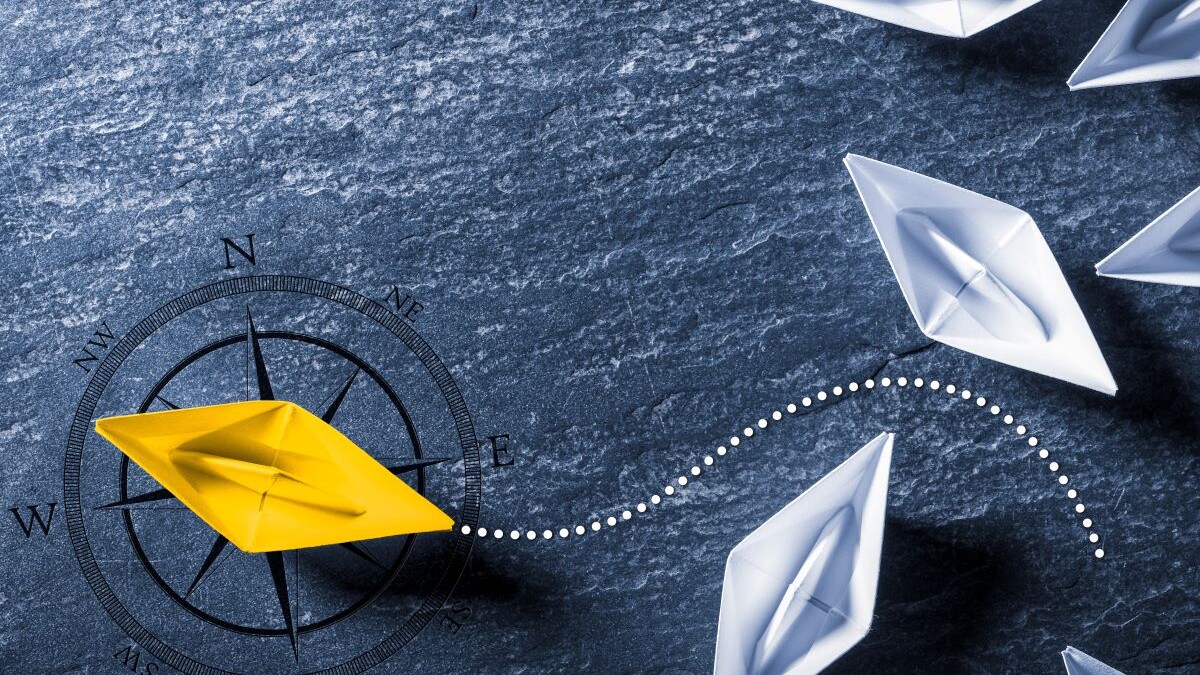 Yellow Paper Boat With Compass Leaving Group And Changing Direction - Entrepreneur/Business Opportunity