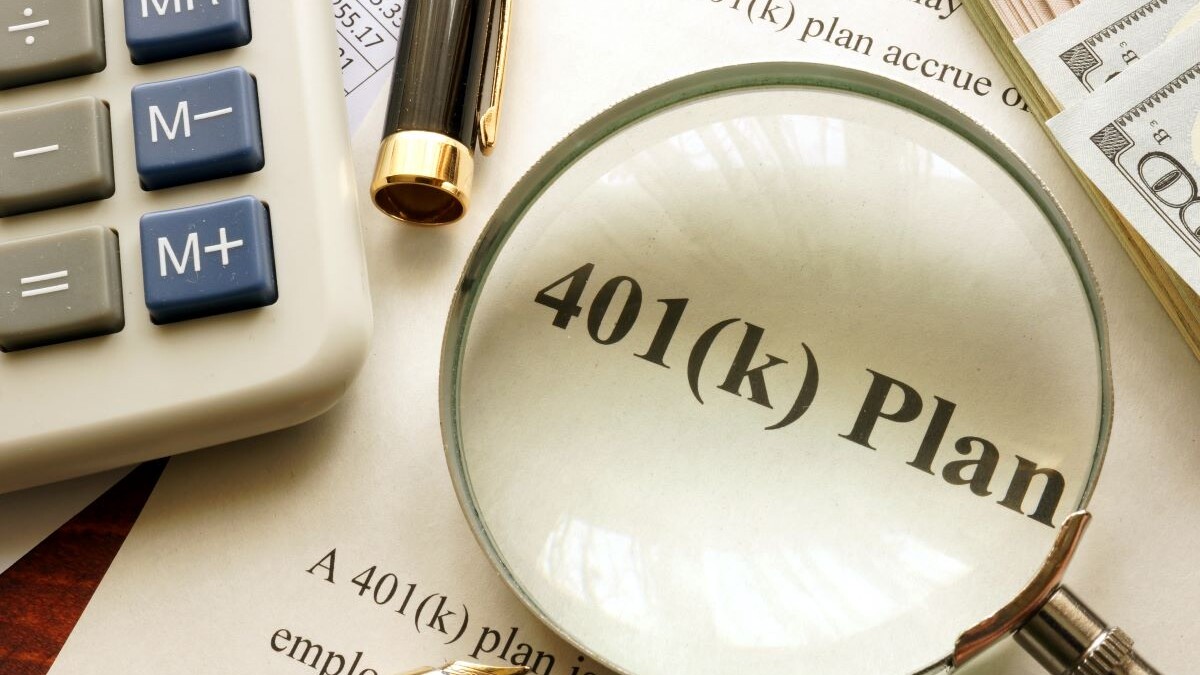 Document with title 401k plan on a table.