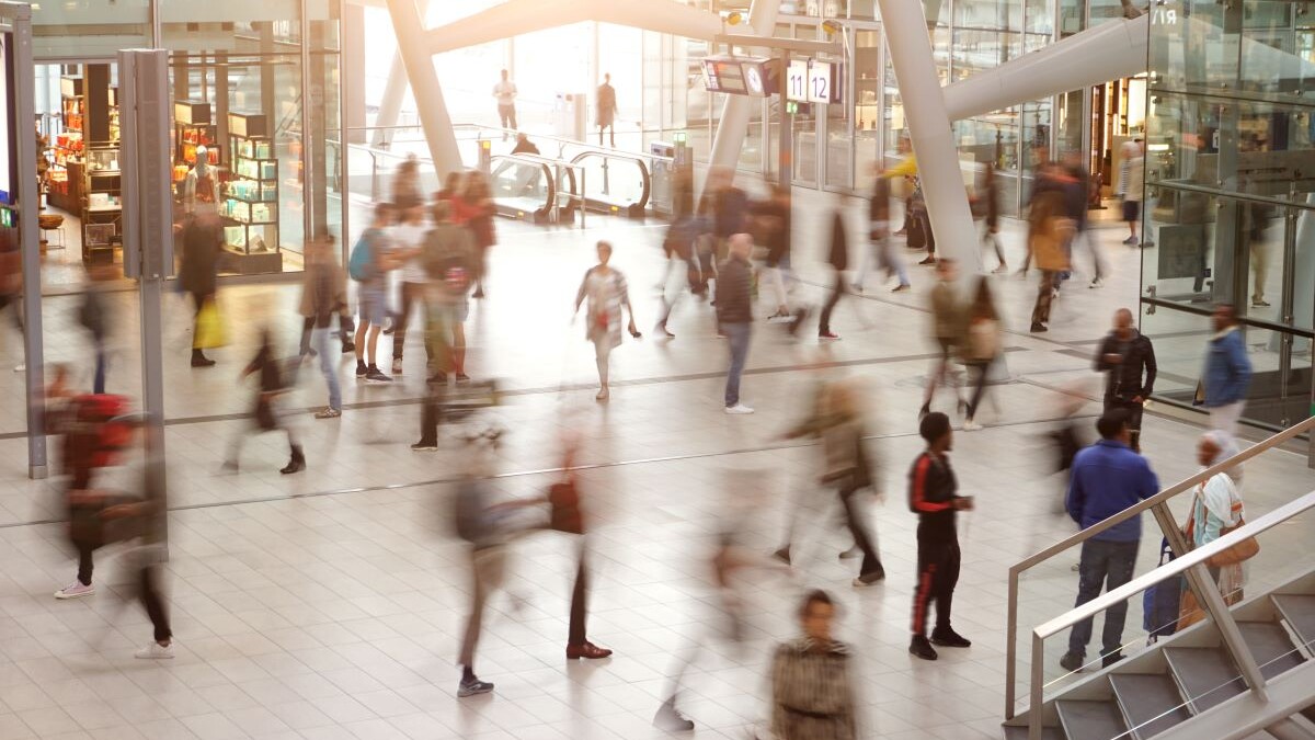 Blurred travelers and people in motion in Central Station or Airport