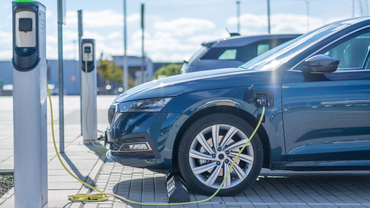Electric car charging at a station