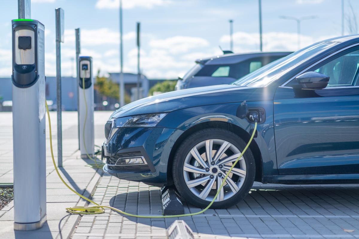 Electric car charging at a station