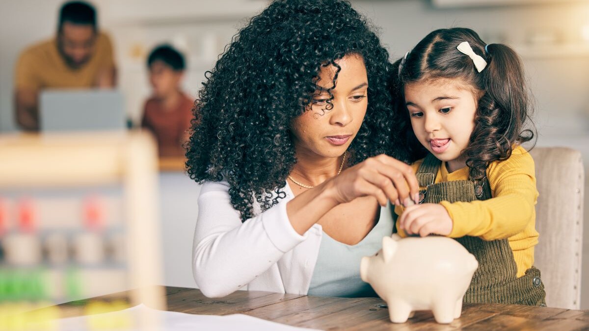 Mother, child and piggy bank, learning about savings with money, investment and future development with finance. Woman, young girl and financial education at home, security and growth with cash