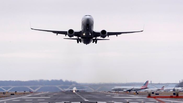 Image of plane taking off of runway