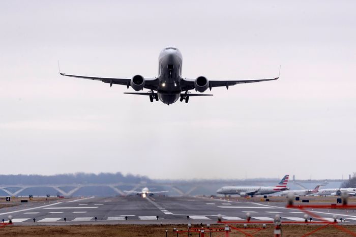 Image of plane taking off of runway