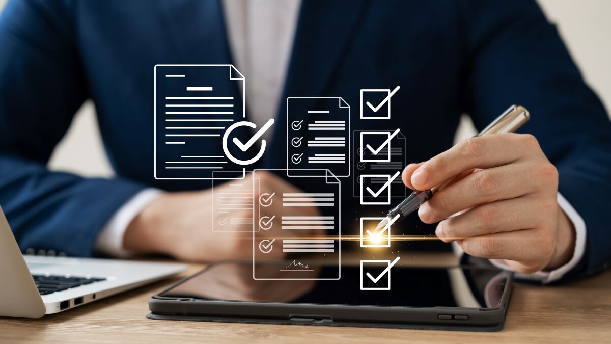 Business performance monitoring concept, businessman using tablet and laptop Online survey filling out, digital form checklist, blue background.