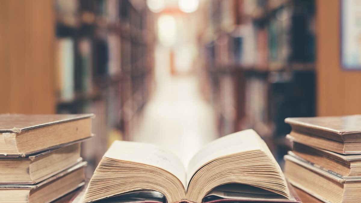 Old book in library with open textbook