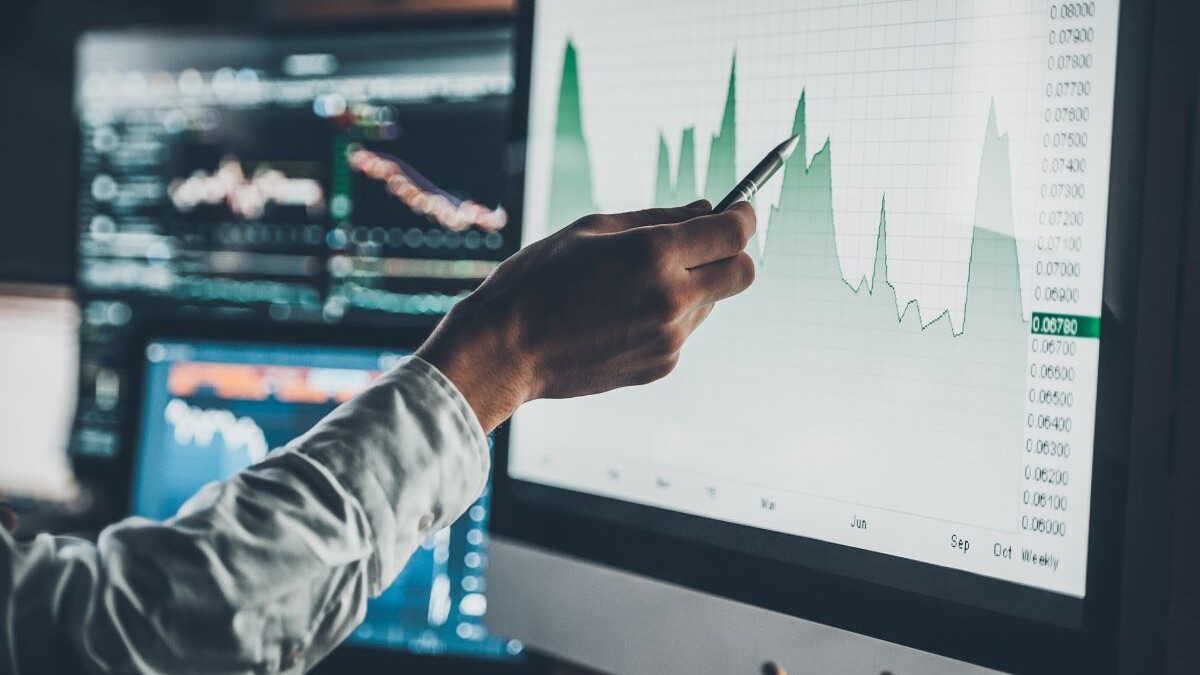 image of person analyzing data in chart