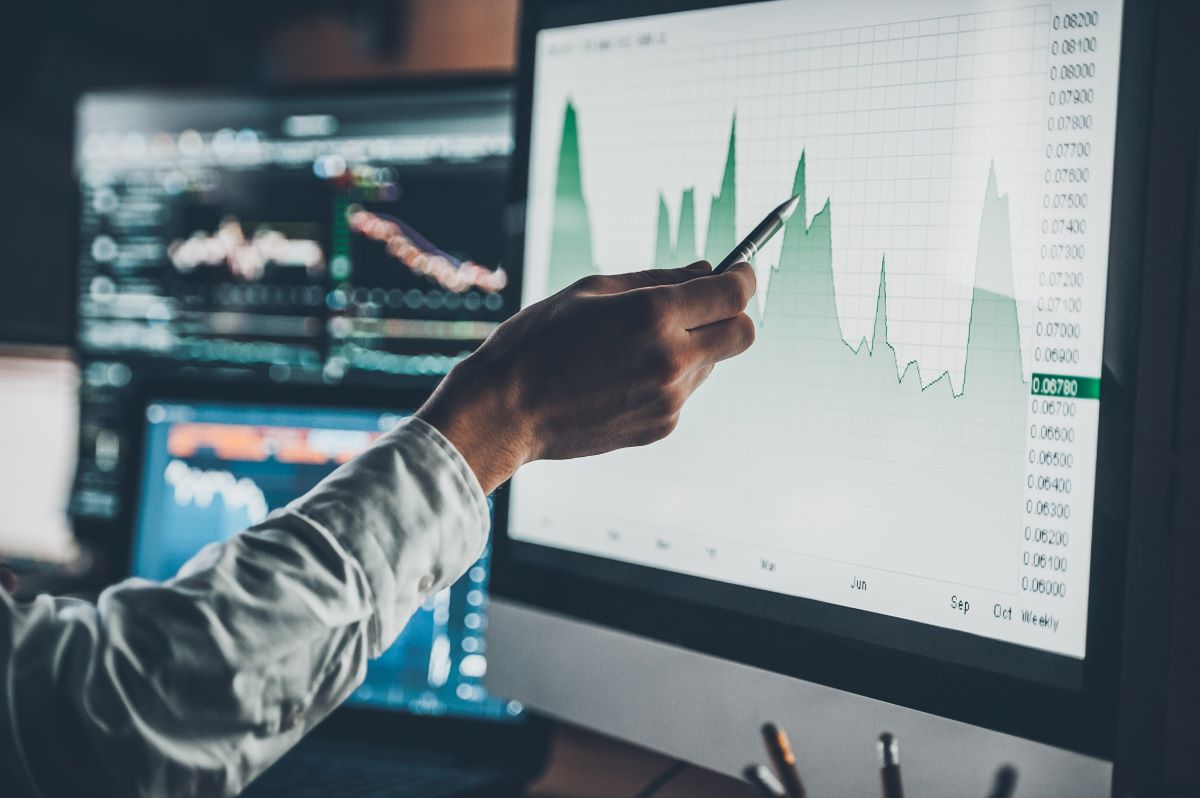 image of person analyzing data in chart