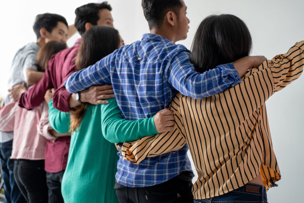 people with interlinked arms