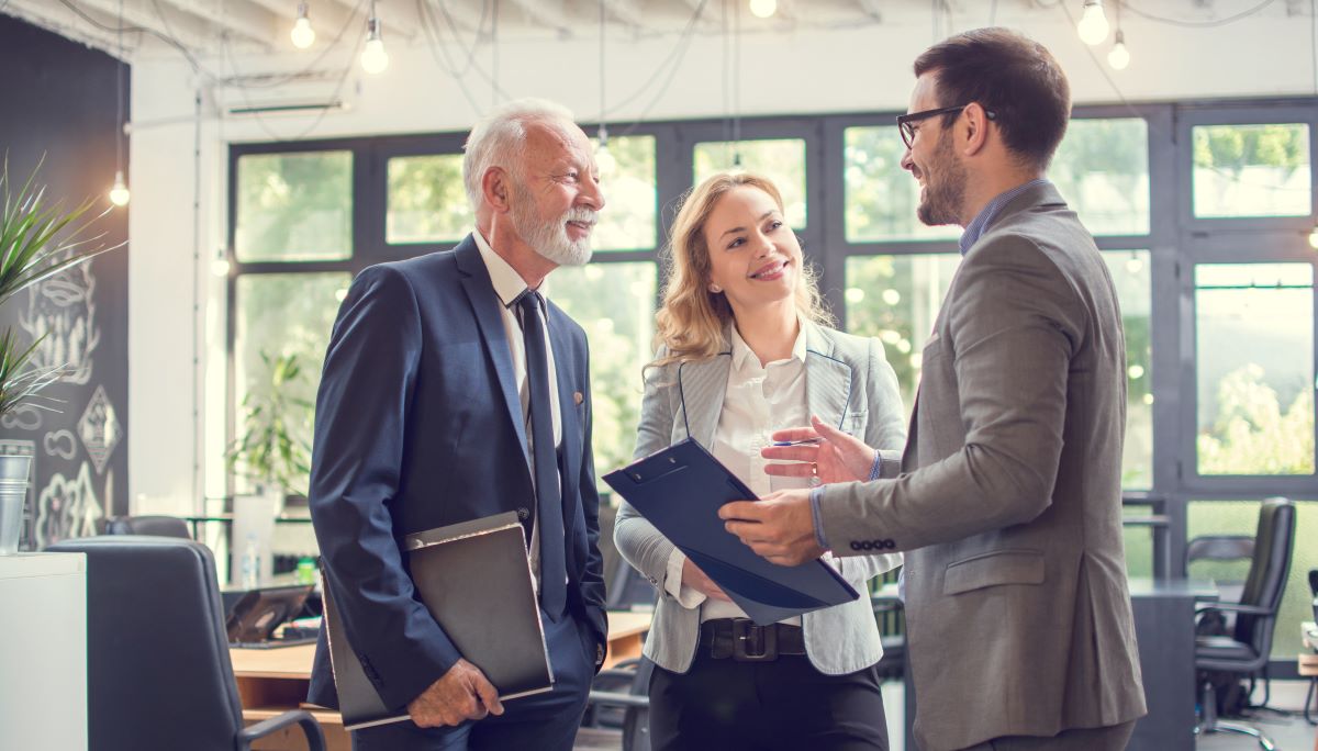three business people talking