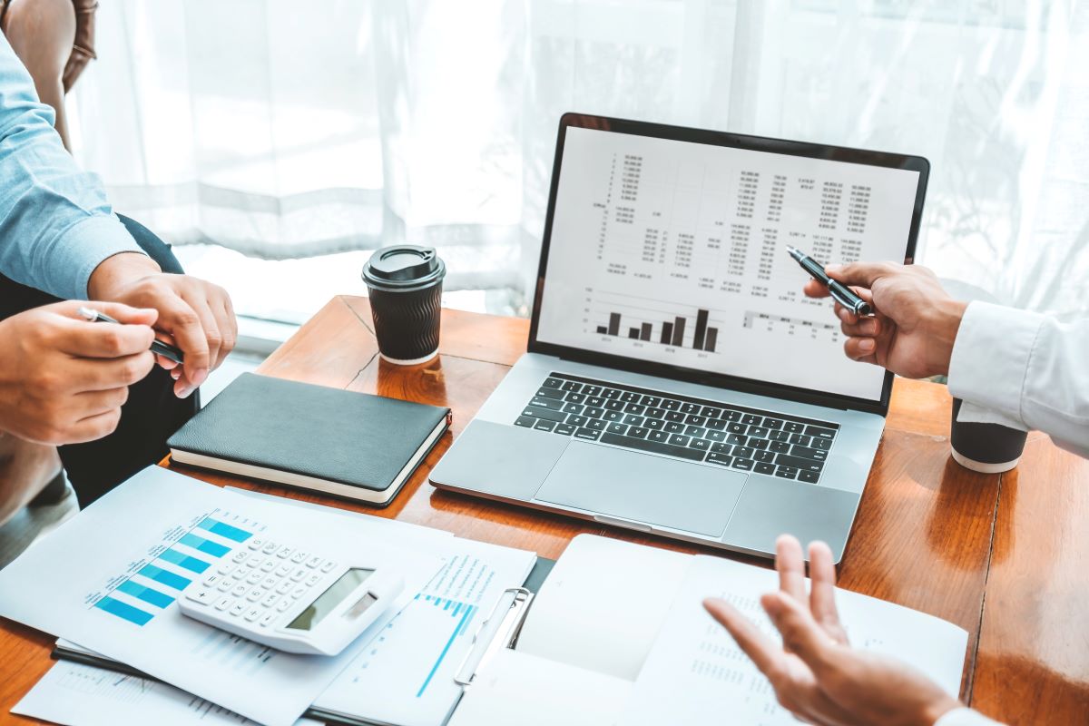Business team meeting Strategy Planning with new startup project plan Finance and Economy Graph with laptop successful teamwork