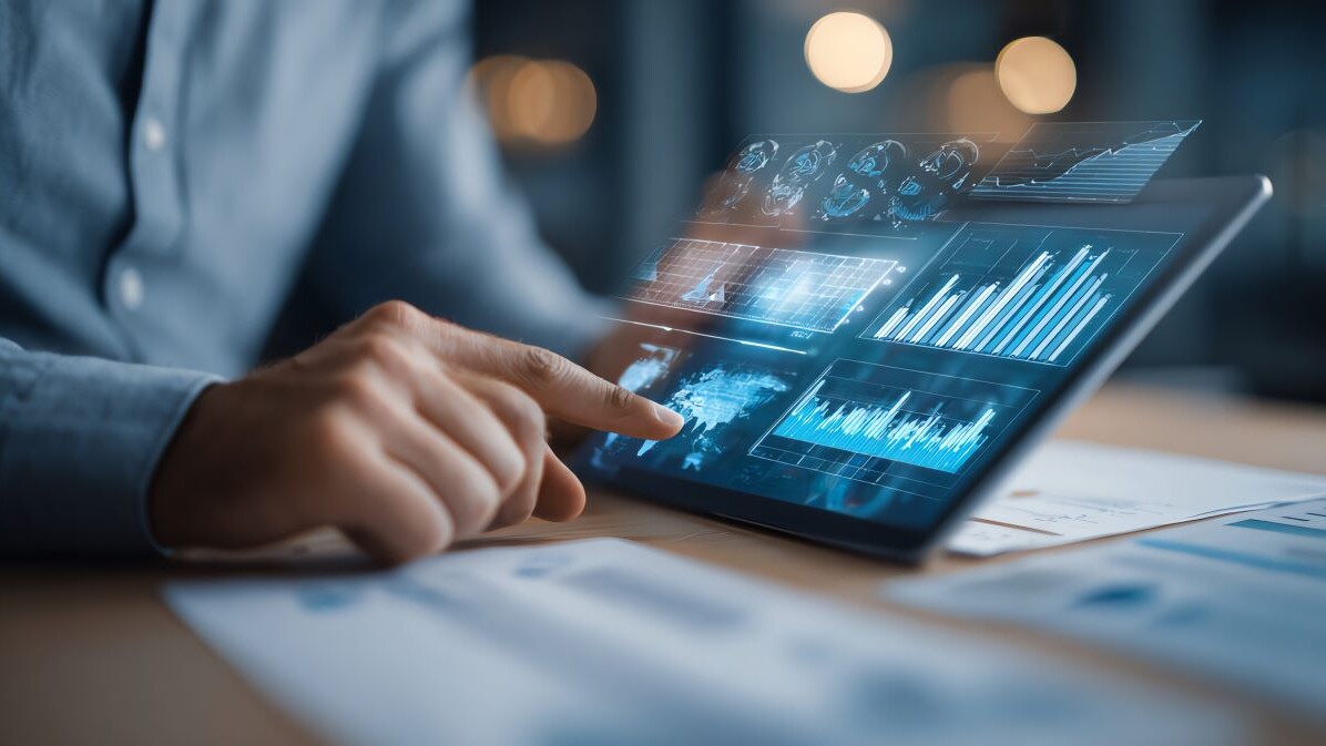 Businessman reviewing quarterly financial report with tablet and graphs AI technology concept