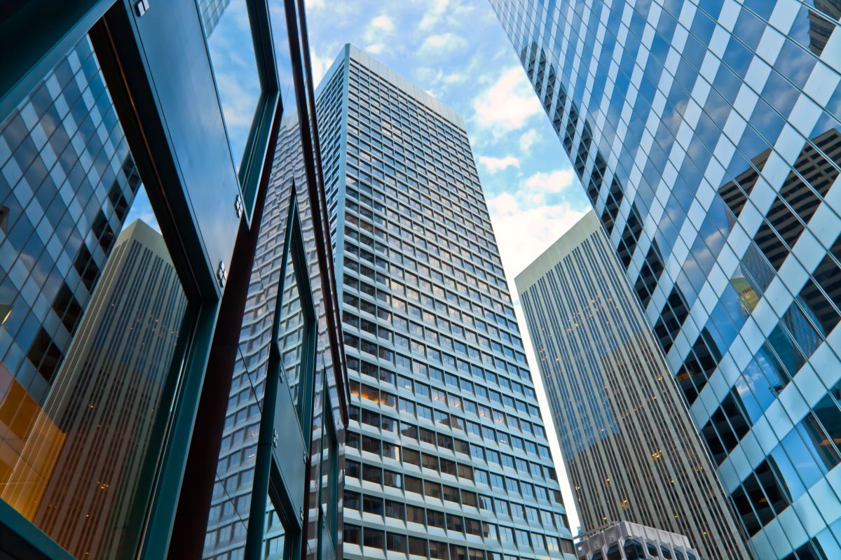 skyscrapers in city with blue reflections