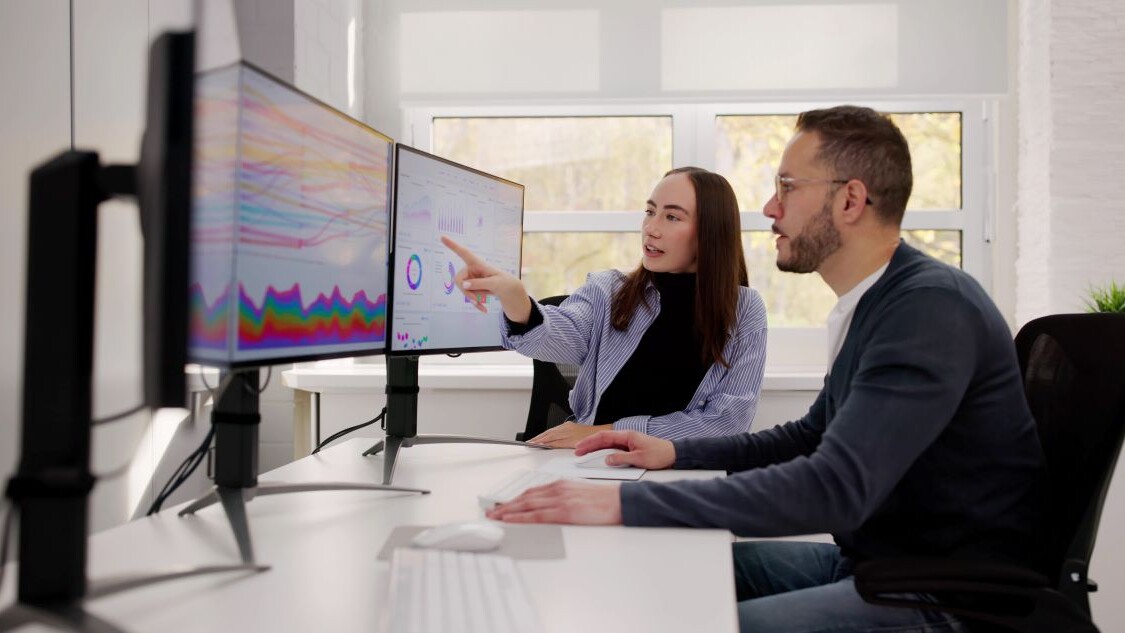 Team Of Analysts Reviewing Business Data