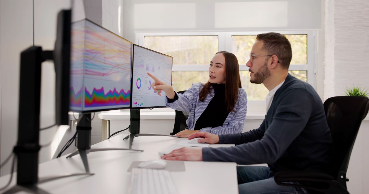 Team Of Analysts Reviewing Business Data