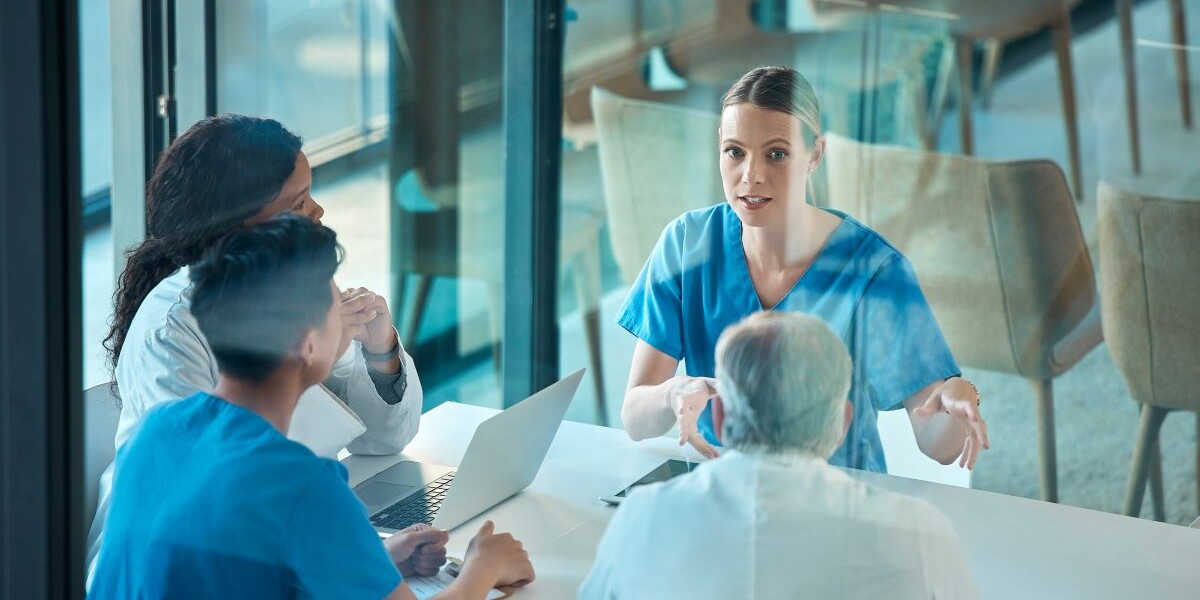 Medical team, doctors and meeting with a laptop for a discussion