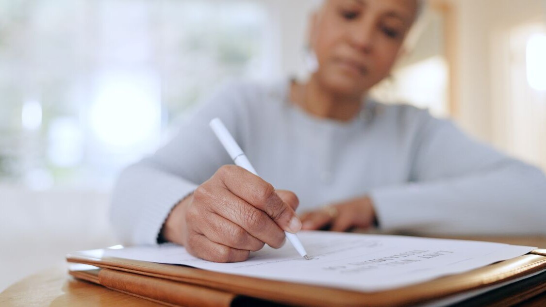 Senior woman, sign and writing with documents