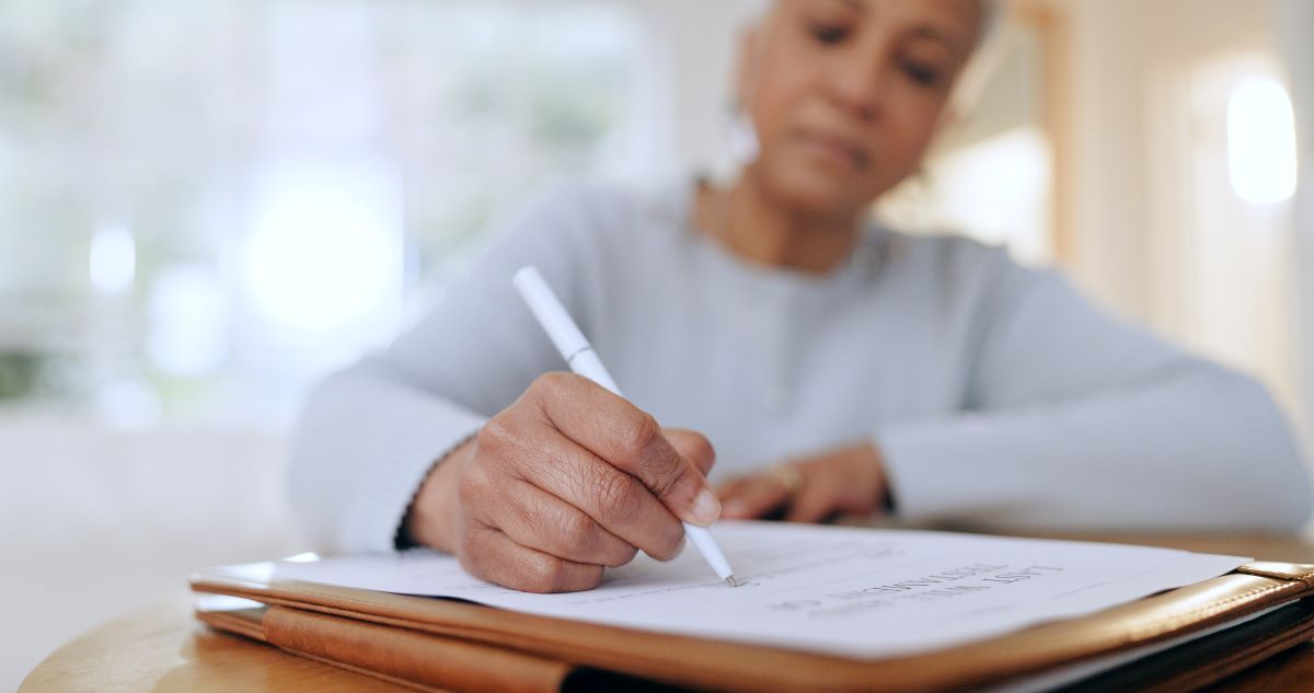 Senior woman, sign and writing with documents