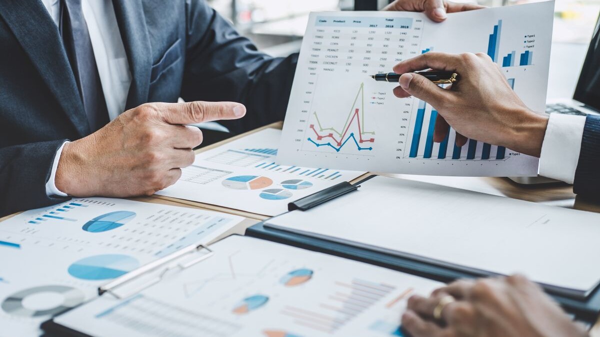 Two executive discussing company growth project success financial statistics, Partner meeting professional investor working start up project for both company with document, laptop and digital tablet