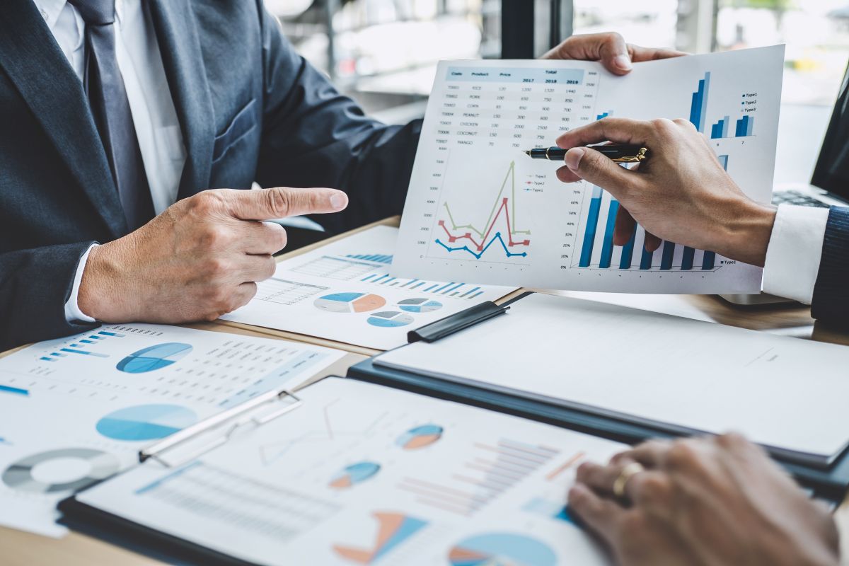 Two executive discussing company growth project success financial statistics, Partner meeting professional investor working start up project for both company with document, laptop and digital tablet