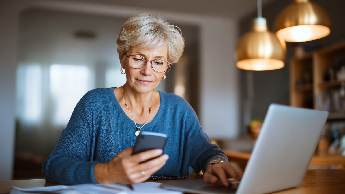 Senior woman reviewing pension information online