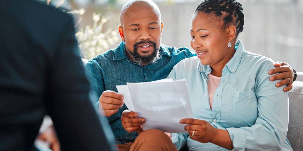 Happy couple, broker and contract in a house for a meeting or consultation for retirement advice.