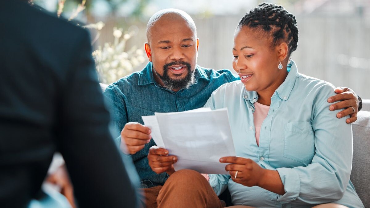 Happy couple, broker and contract in a house for a meeting or consultation for retirement advice.