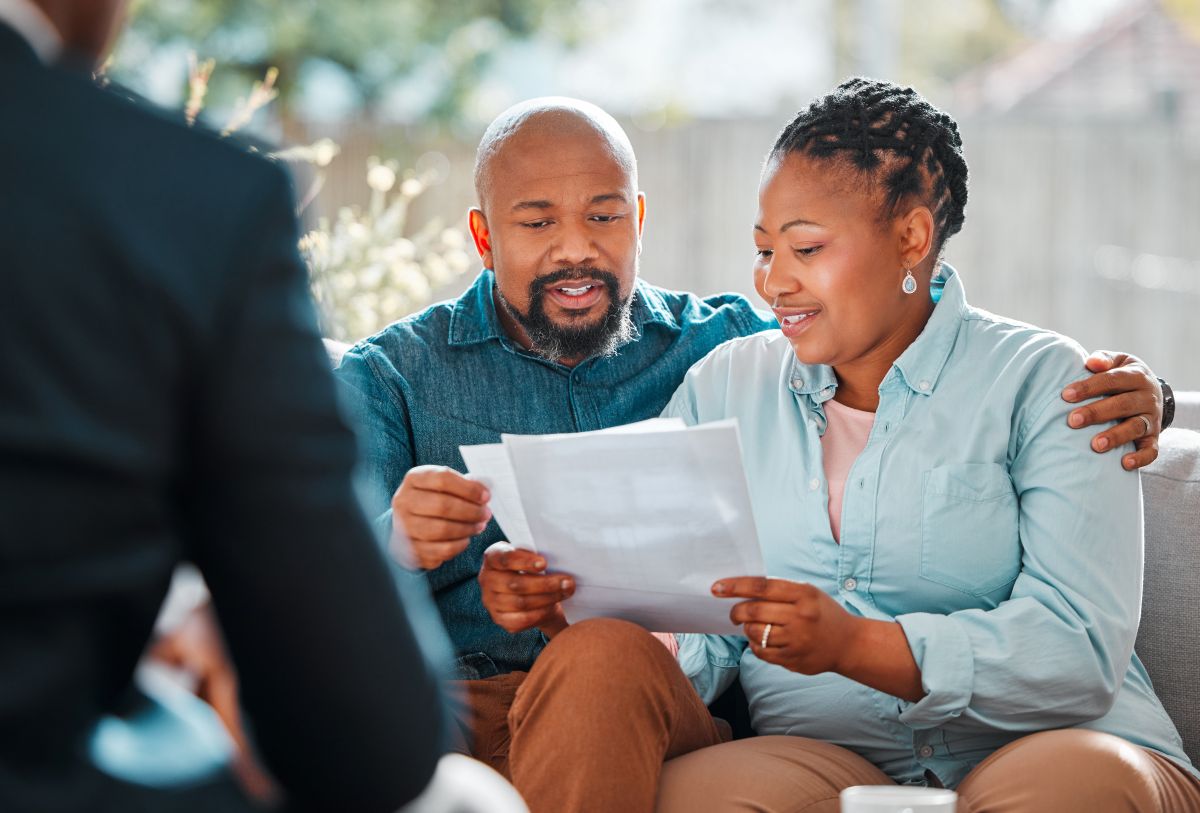Happy couple, broker and contract in a house for a meeting or consultation for retirement advice.