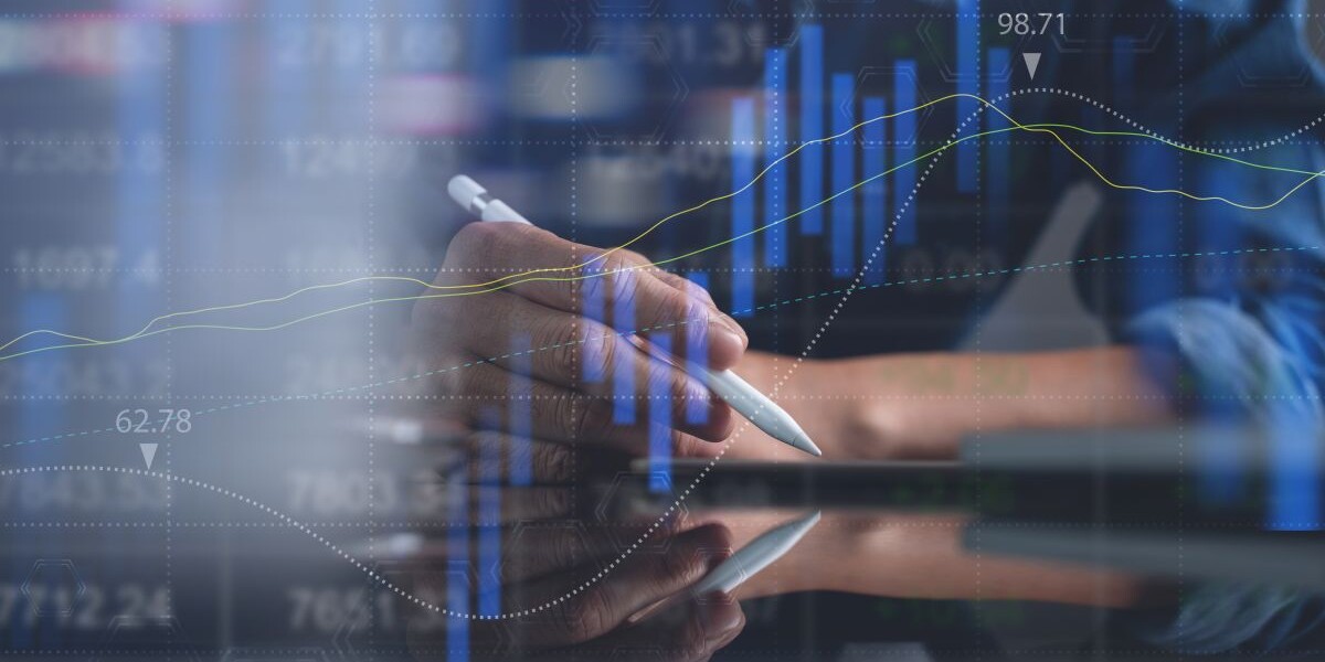 Business man analyzing stock market report with financial graph