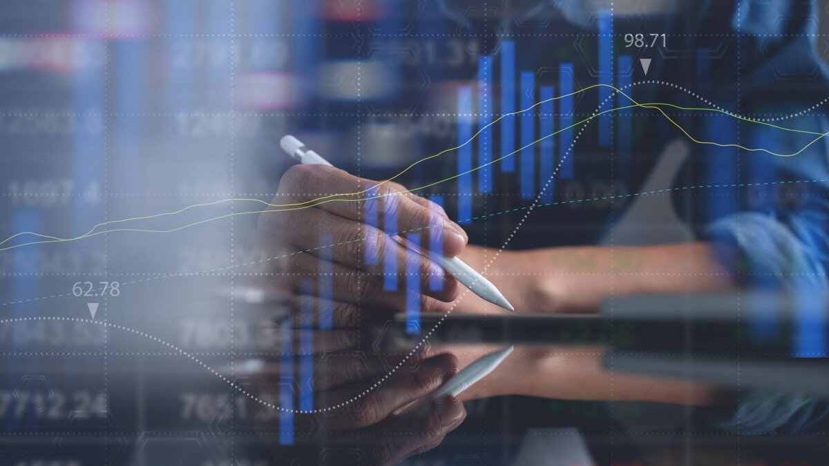 Business man analyzing stock market report with financial graph